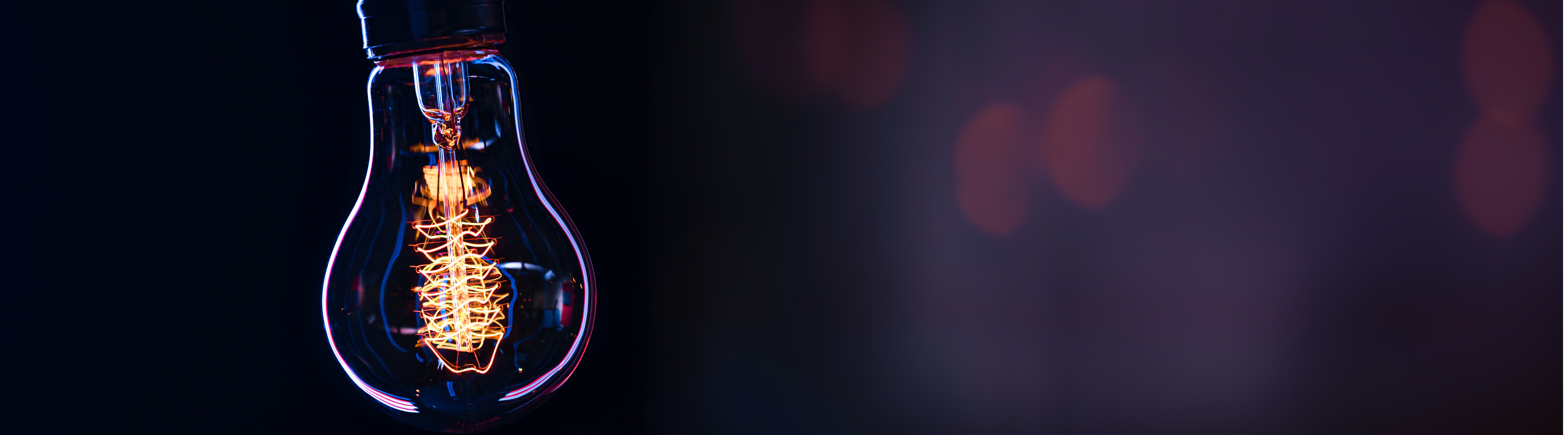 burning lamp hangs dark blurred background space text